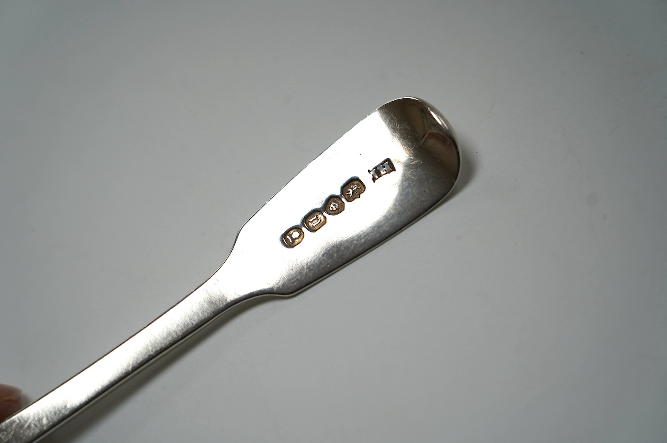 A set of six George IV silver fiddle pattern dessert spoons, John Hawkins, London, 1828, 16.7cm, 7oz. Condition - fair